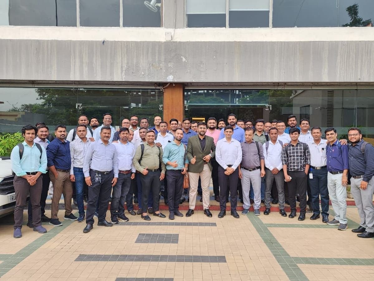Large corporate cohort gathered outside the venue after an AI training day
