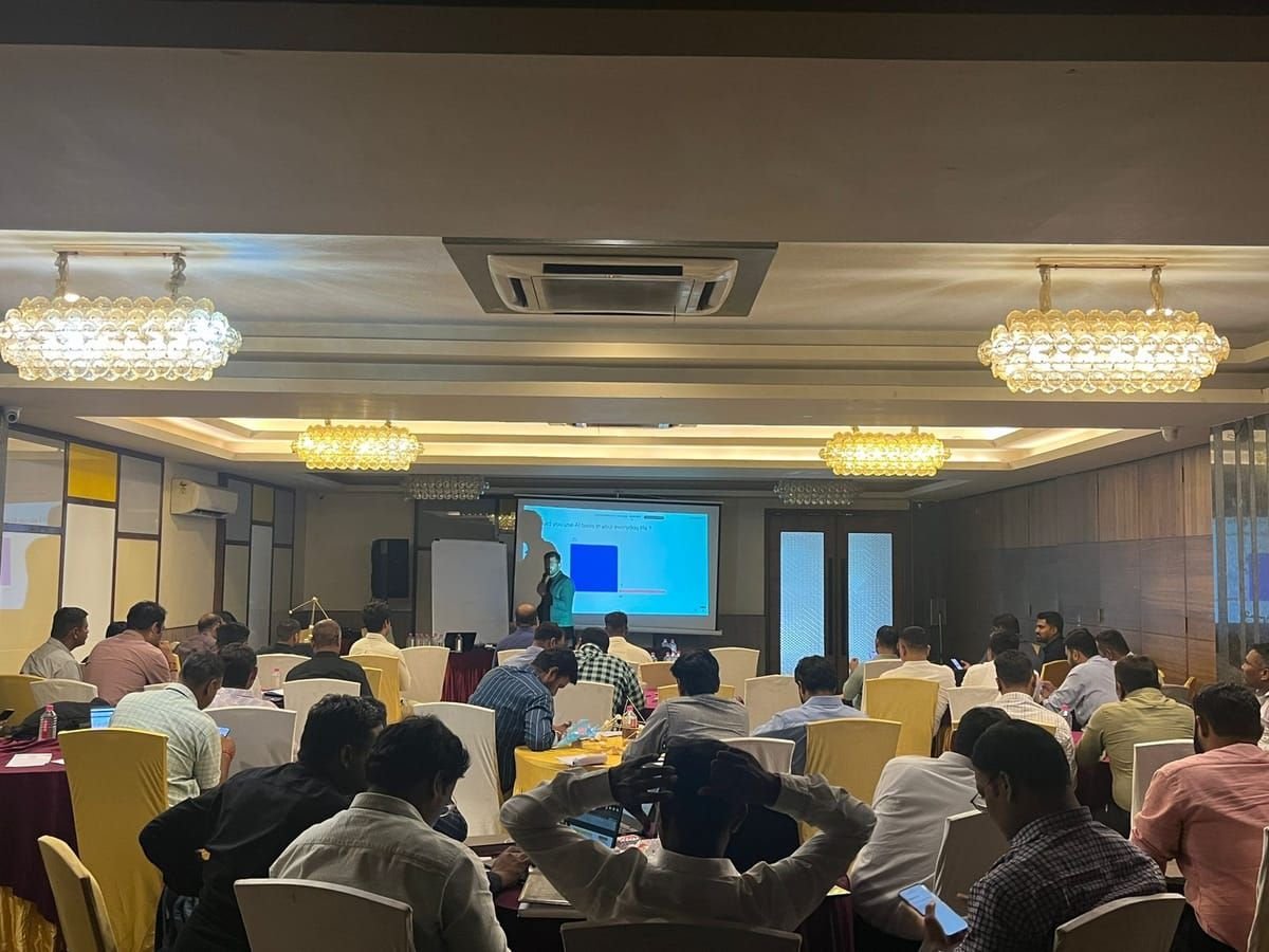 A full training room responding to a live poll on everyday AI tool use
